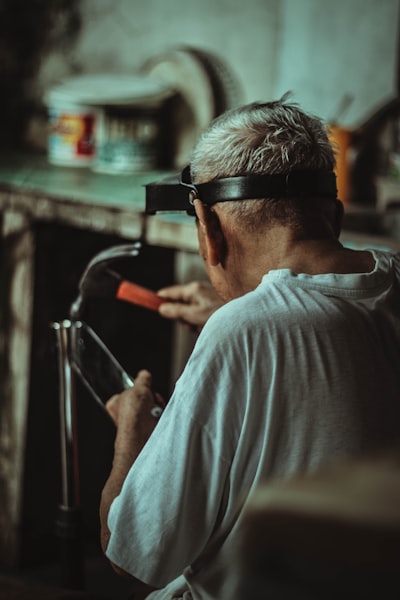 man in white crew neck shirt wearing black sunglasses